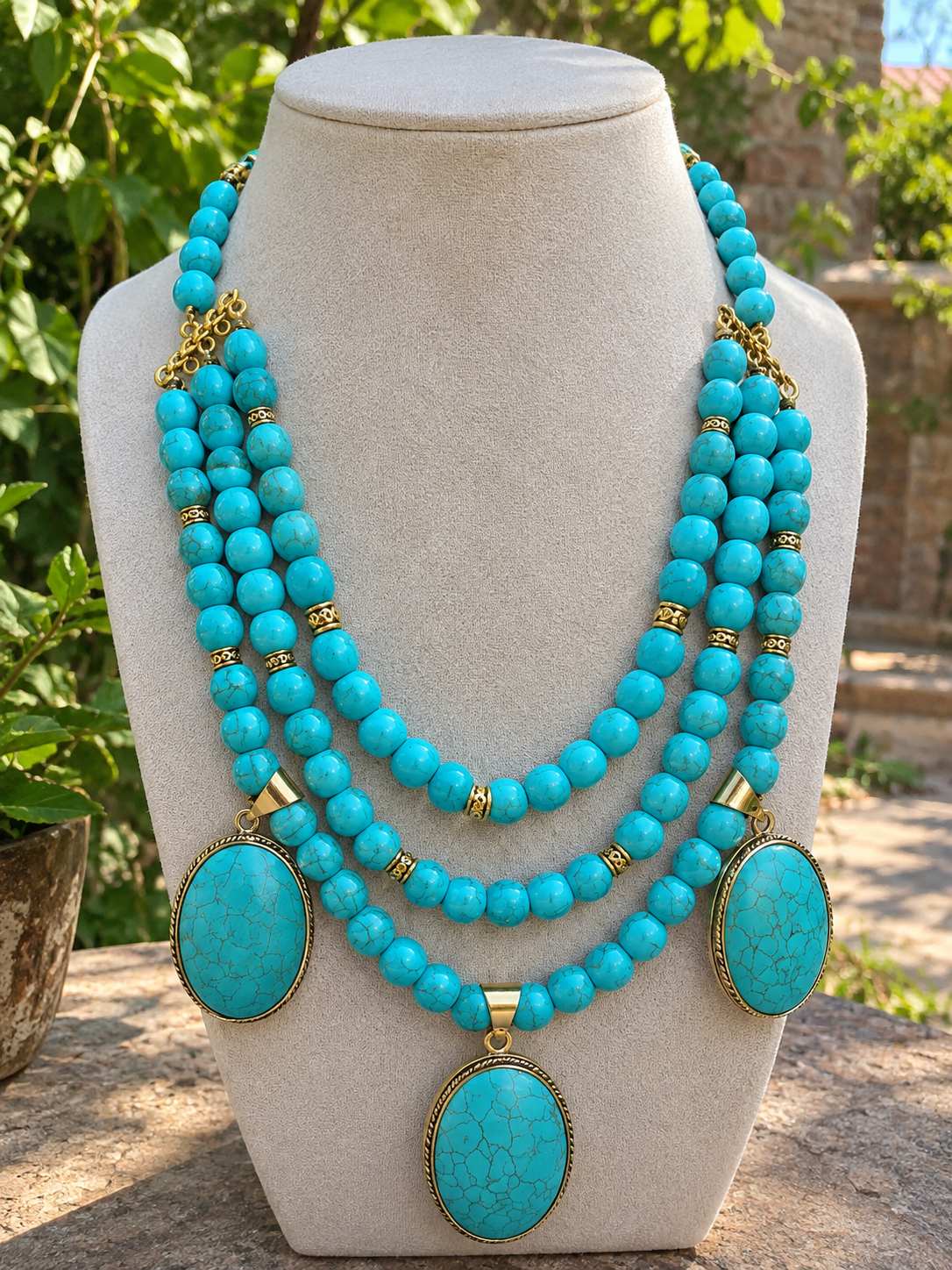 Ferozi necklace with brass Ferozi pendants.