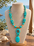 Beaded necklace with a turquoise-colored pendant