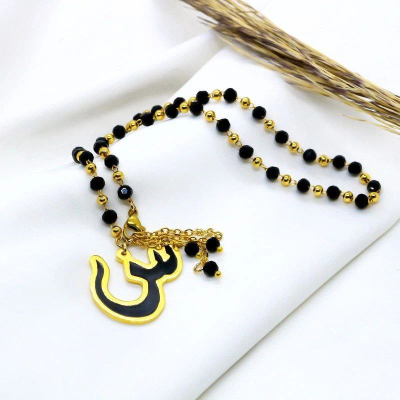 A letter-adorned necklace embellished with crystals