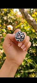 Nickel-plated ring, one size fits all.