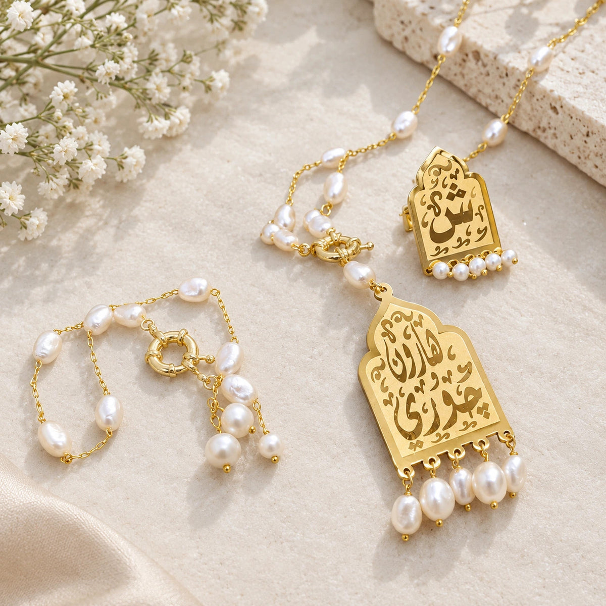 A gold-plated name necklace.