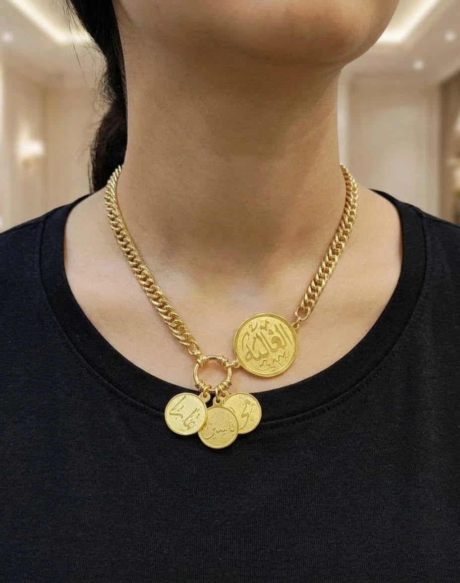 A gold-plated name necklace.