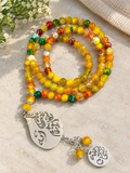 Agate prayer beads with a nickel pendant.